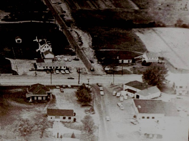 An aerial view of Dunn's Corners taken Sept. 9, 1964. The top right corner of the picture is where Benny's & Walmart are located today. The bottom left corner is where Station 1 resides in place of the old community house. Ed Greenes Gas station sits where Mobil is today. The Blue Moon Tea Room was located where the Credit Union operates today.